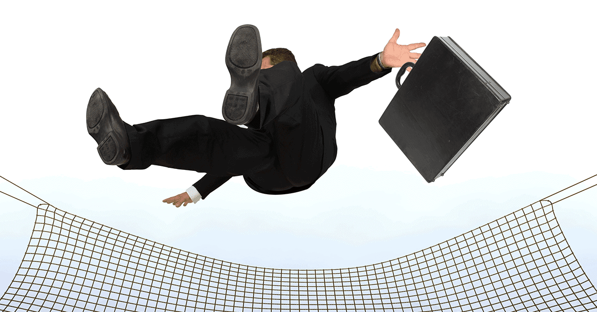 businessman falling into a safety net