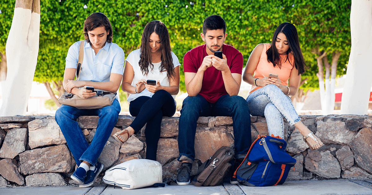 Millennials on smartphones ignoring each other